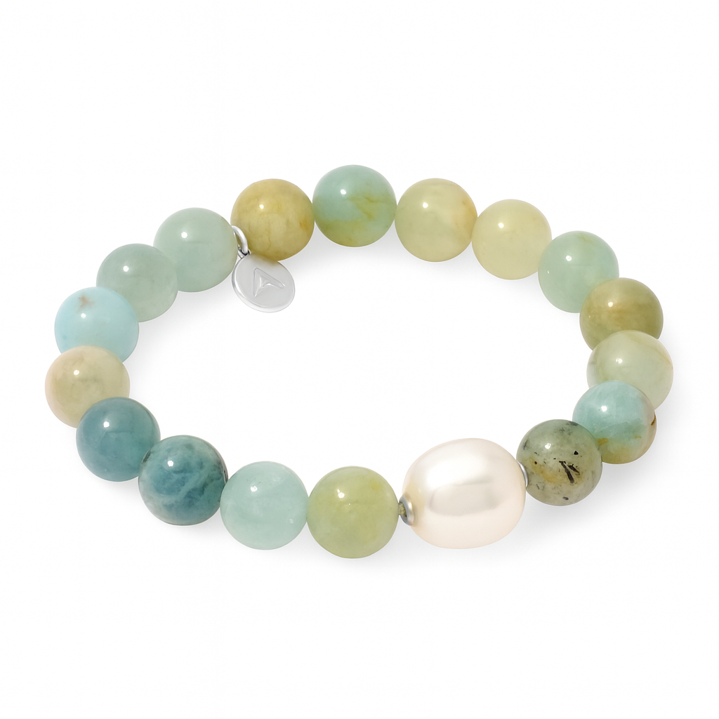 Beaded bracelet with green beads and a white pearl on a white background