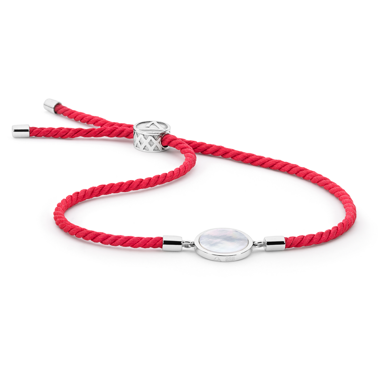 Adjustable bracelet featuring Mother of Pearl, set on a vibrant red Japanese silk cord. The piece symbolizes sustainability and prosperity, with its bold red hue evoking coral reefs near Atlas' biodiverse pearl farms.
