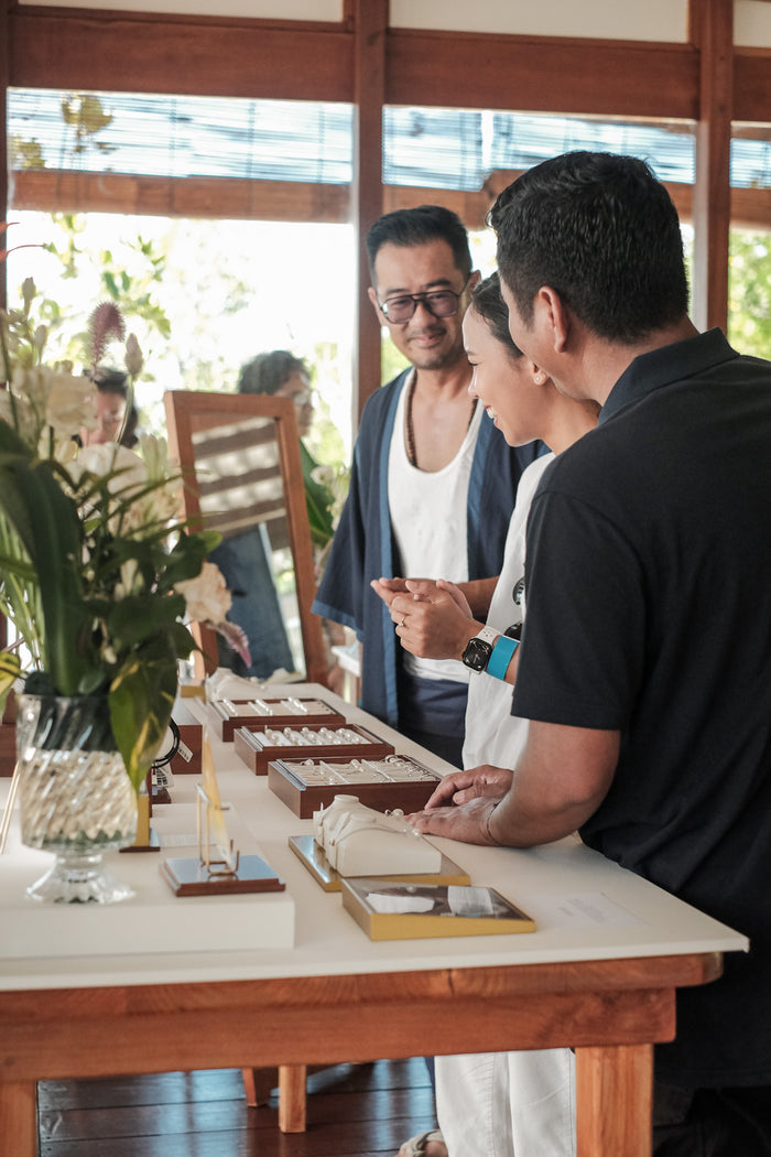 People admiring jewellery in a showroom