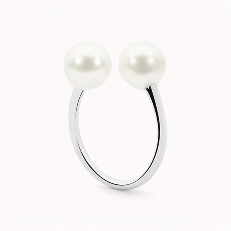 Silver ring with two pearls on a white background