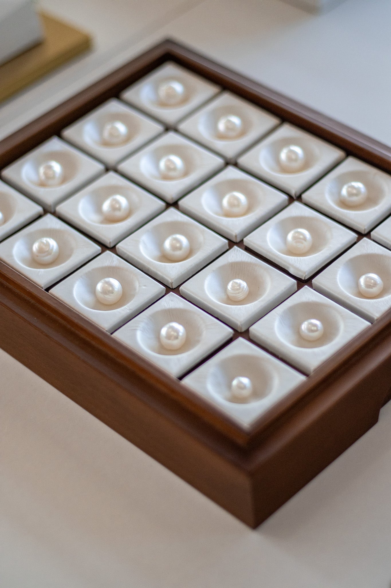 Tray of loose pearls on display