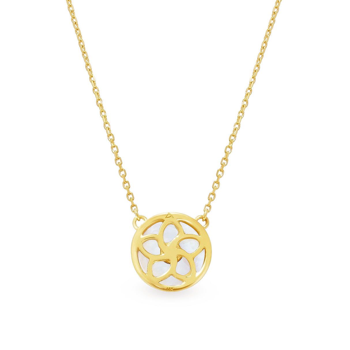A 18K yellow gold necklace with a circular mother of pearl pendant and blue sapphire accents on a chain.