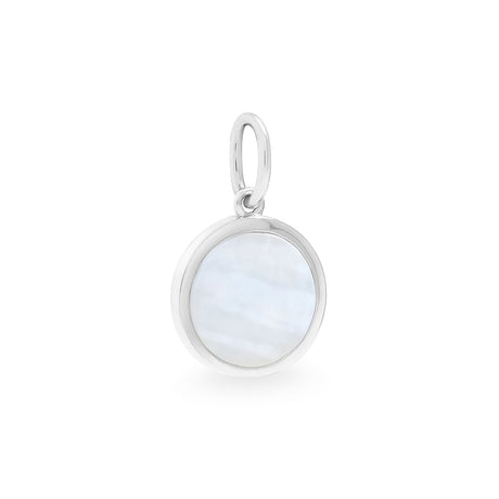 A round silver pendant with a mother of pearl shell inset, suspended from a small loop.