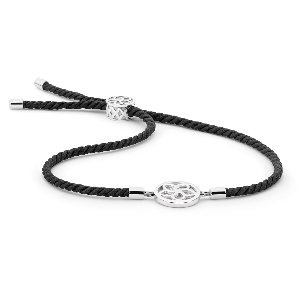 Adjustable bracelet featuring Mother of Pearl on black silk cord, symbolizing sustainability and clarity. The piece evokes the serene energy of the midnight seas where Atlas' pearl farms thrive, blending natural beauty with refined craftsmanship.