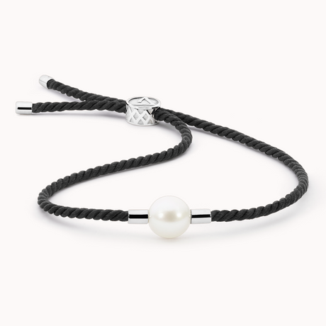 Black braided cord bracelet with a pearl on a white background