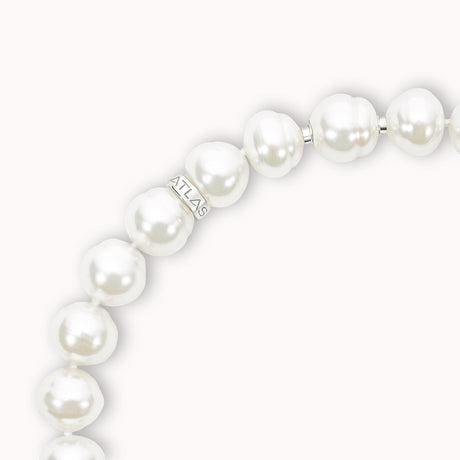 Pearl bracelet with 'ATLAS' brand name on a white background