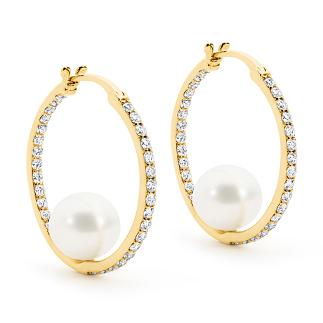 Gold hoop earrings with pearls and diamonds on a white background