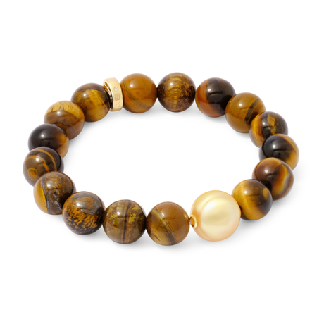 Beaded bracelet with orange mixed beads and a white pearl on a white background