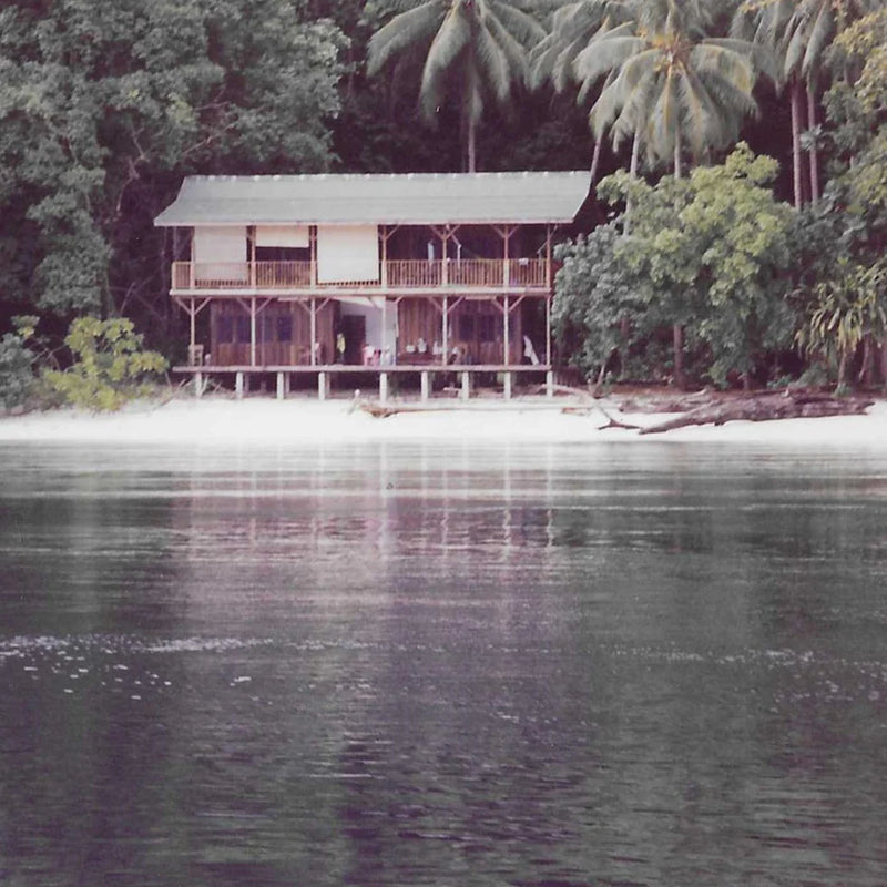 Double story building on the beach made from wood. 