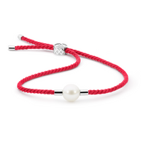 Adjustable bracelet featuring a 10mm white South Sea pearl with a 925 silver finish and vibrant red Japanese silk cord, symbolizing sustainability, fortune, and happiness. A perfect fusion of luxury and meaning.
