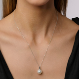 On model This pendant features 18K white gold with a modern looped design, accented by a white 11mm South Sea pearl. It is enhanced with 0.10ct of diamonds. The design is available in 18K white, yellow, and rose gold. Chains are sold separately, and matching earrings are also available.