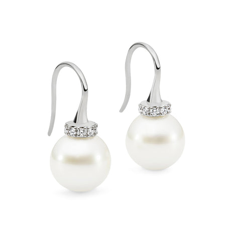 These 18K White Gold shepherd hook earrings feature 10mm South Sea pearls and 0.15ct diamonds. The design is available in 18K White, Yellow, and Rose Gold. The total height of the earrings is 25mm. A matching pendant is also available for a coordinated look.