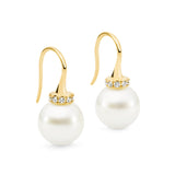 These 18K Yellow Gold shepherd hook earrings feature 10mm South Sea pearls and 0.15ct diamonds, combining elegance with a modern touch. The total height is 25mm, and they are available in 18K White, Yellow, and Rose Gold. Perfect for adding a refined, luxurious element to any outfit. You can view the matching pendant as well for a complete set.