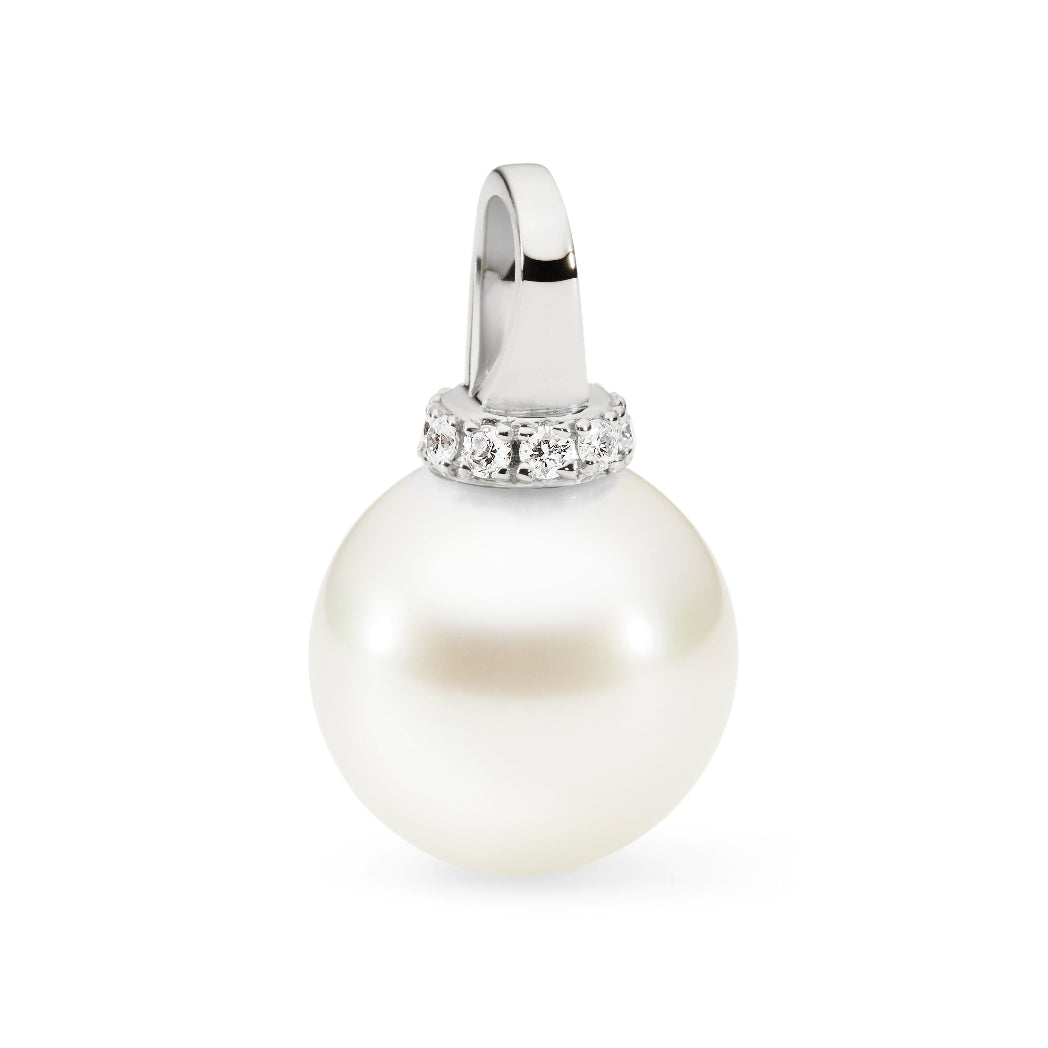 This pendant features 18K white gold with a modern looped design, accented by a white 11mm South Sea pearl. It is enhanced with 0.10ct of diamonds. The design is available in 18K white, yellow, and rose gold. Chains are sold separately, and matching earrings are also available.