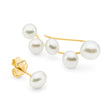 These 14K yellow gold ear climbers are adorned with five South Sea Keshi pearls, sized at 4mm and 5mm. Sold with a single pearl stud, they measure 21 x 7mm, offering a delicate and stylish look. Perfect for those seeking unique, elegant earrings.