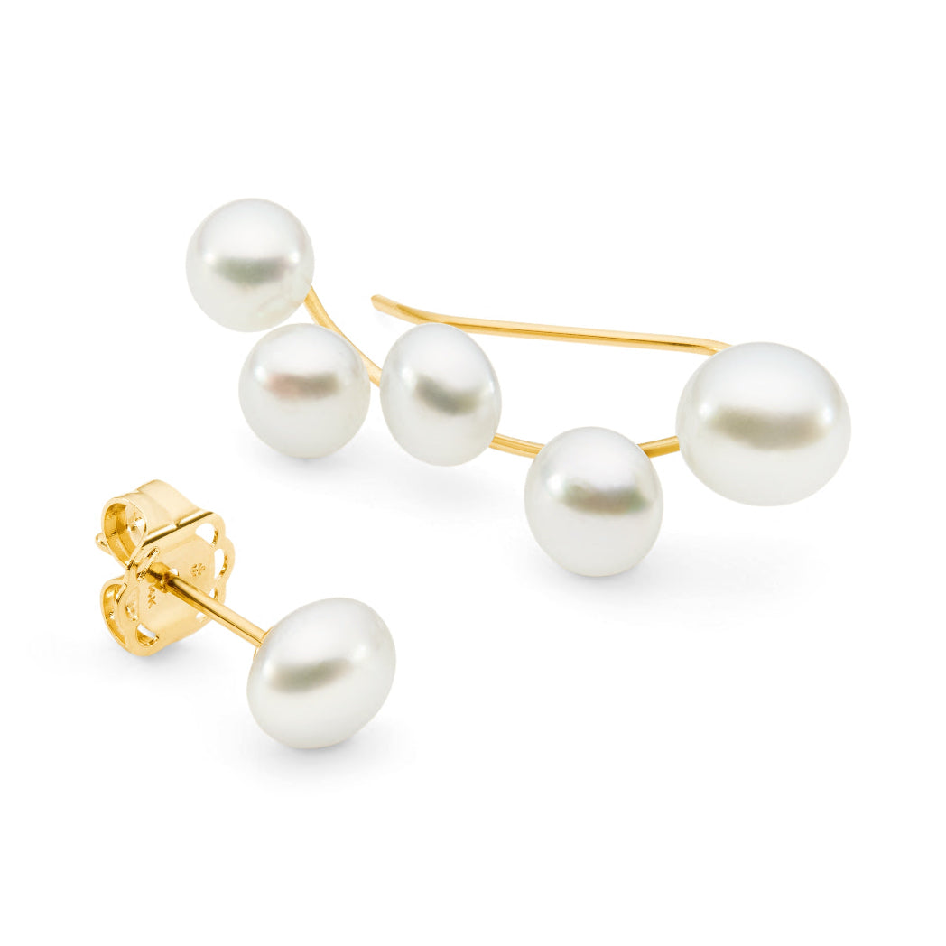 These 14K yellow gold ear climbers are adorned with five South Sea Keshi pearls, sized at 4mm and 5mm. Sold with a single pearl stud, they measure 21 x 7mm, offering a delicate and stylish look. Perfect for those seeking unique, elegant earrings.