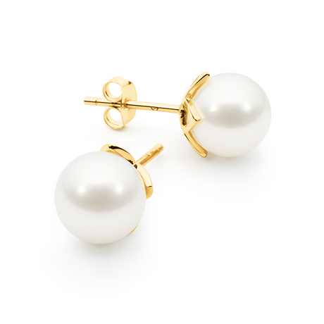 These stud earrings feature 8mm round South Sea pearls set in 18K yellow gold frangipani cups. With a classic design reflecting the beauty of the frangipani flower, they offer elegance for any occasion. The pearls are graded B, ensuring a radiant white hue, and the dimensions are 8mm by 8mm. These earrings are a timeless accessory for those seeking understated luxury.