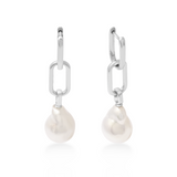 Pearl drop earrings with silver hooks on a white background
