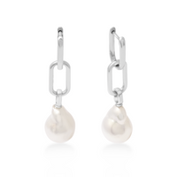 Pearl drop earrings with silver hooks on a white background