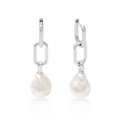 Pearl drop earrings with silver hooks on a white background