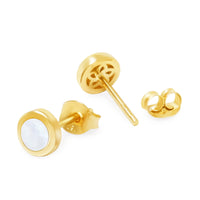 A pair of 18K yellow gold stud earrings with a mother of pearl shell inset, displayed alongside a gold ring.