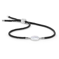 Adjustable bracelet featuring Mother of Pearl on black silk cord, symbolizing sustainability and clarity. The piece evokes the serene energy of the midnight seas where Atlas' pearl farms thrive, blending natural beauty with refined craftsmanship.