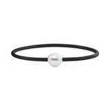 This black neoprene bracelet features a 10mm Circle South Sea pearl, known for its distinct concentric lines. The pearl, selected for its heavily circled appearance, adds a unique touch to the design. The bracelet is available in lengths of 17, 19, and 21cm, offering a customizable fit.