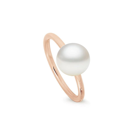 This is a simple and classic 18K Yellow Gold ring featuring a South Sea pearl with a flat button shape. The pearl is 10mm in size, grade B, and white in color. The ring is available in sizes, with the current one being a US size 7. The design is also offered in 18K White and Rose Gold.