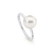 This elegant 18K White Gold ring features a 10mm Flat Button South Sea pearl. It is available in US size 7 and can also be ordered in 18K Yellow and Rose gold. The design is sleek and classic, perfect for those seeking a sophisticated pearl ring.