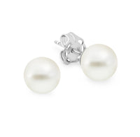 A pair of white pearl stud earrings with a 925 sterling silver finish.