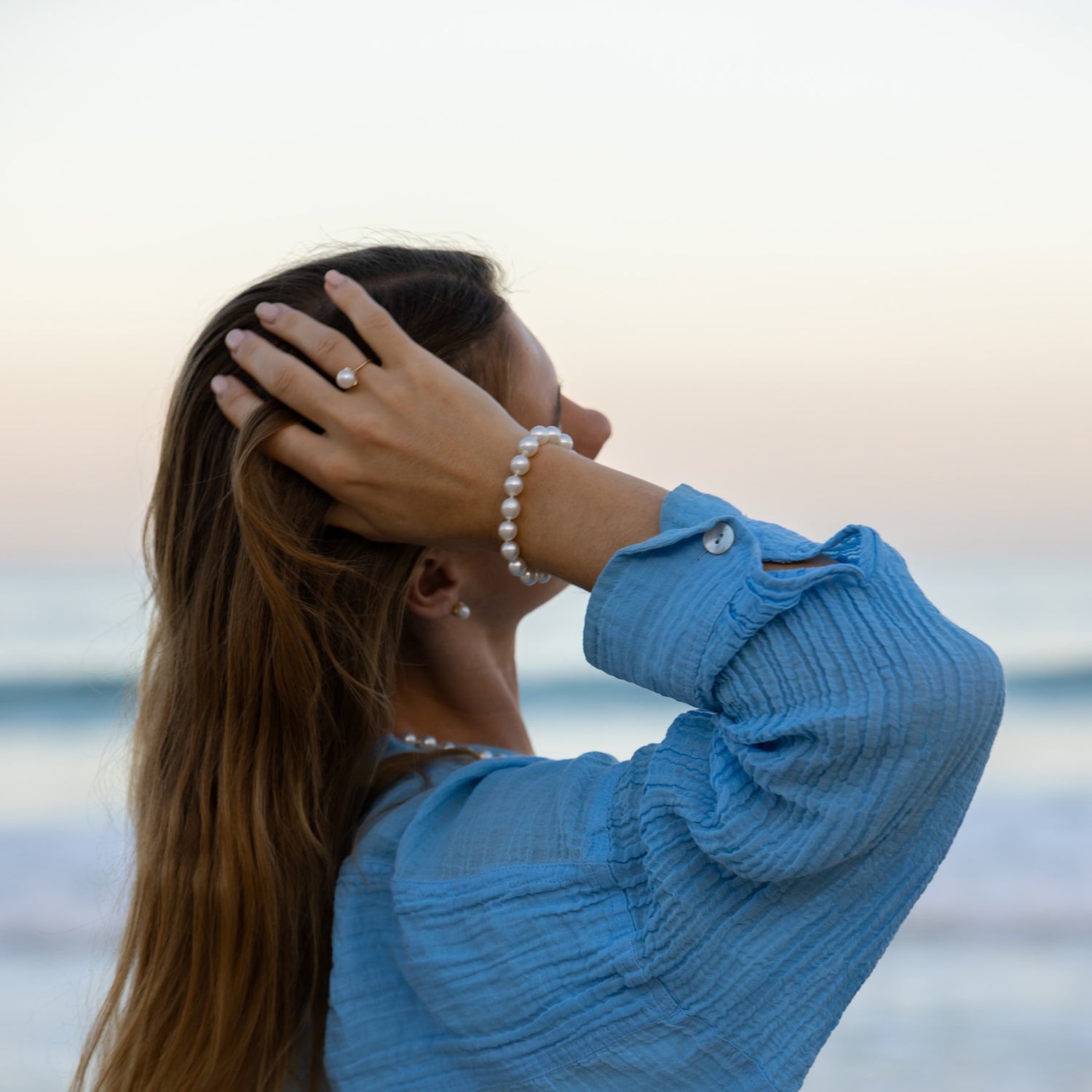 Woman in a blue sweater with a blurred background