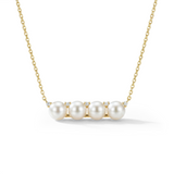 Pearl necklace with gold chain on a white background