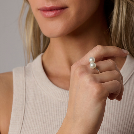 On model This simple and classic 18K white Gold ring features two 8mm South Sea pearls, offering timeless elegance. The design is also available in 18K yellow and Rose Gold, providing versatility for different tastes. The ring is adjustable, ensuring a comfortable fit.