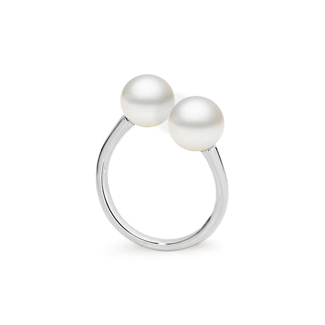 This simple and classic 18K white Gold ring features two 8mm South Sea pearls, offering timeless elegance. The design is also available in 18K yellow and Rose Gold, providing versatility for different tastes. The ring is adjustable, ensuring a comfortable fit.